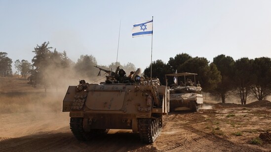 Latest news on June 6, 2024: Israeli soldiers gesture while riding in an armoured personnel carrier (APC), after returning from the Gaza Strip, amid the ongoing conflict between Israel and Hamas, near the Israel-Gaza border, in Israel, June 5, 2024.