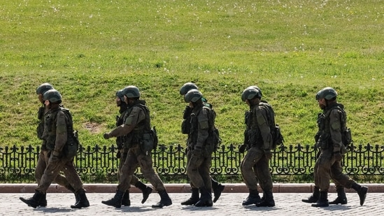 Russian army servicemen walk at an exhibition displaying armoured vehicles and equipment captured by the Russian army from Ukrainian forces in Moscow, Russia on May 31(REUTERS)