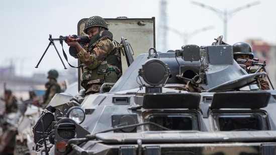 Bangladeshi military forces on armored vehicles patrol on the streets of Dhaka, Bangladesh, Saturday, July 20, 2024. (AP)