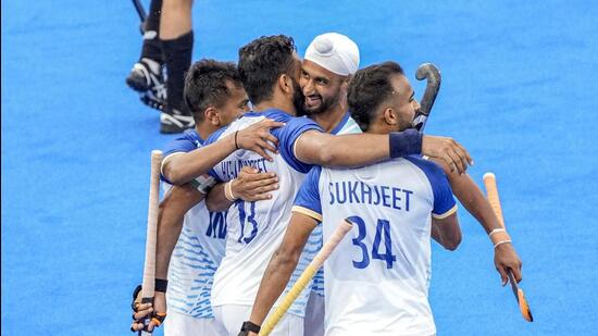 India's Harmanpreet Singh with teammates celebrates after scoring a goal from a penalty stroke against New Zealand during the Pool B hockey match between India and New Zealand, in Paris, Saturday. (PTI)