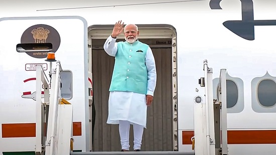  Prime Minister Narendra Modi gestures before leaving for Moscow in New Delhi.(PTI)