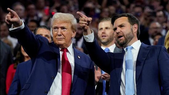 Republican presidential nominee and former U.S. President Donald Trump and Republican vice presidential nominee J.D. Vance point to the stage during Day 1 of the Republican National Convention (RNC), at the Fiserv Forum in Milwaukee, Wisconsin, U.S. (REUTERS)