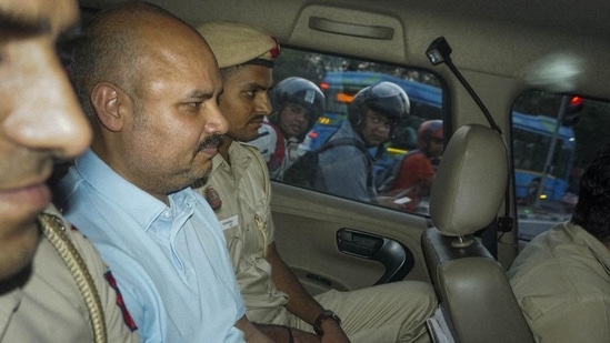 Delhi Police with chief minister Arvind Kejriwal’s aide Bibhav Kumar leave CM's residence after recreation of the scene in AAP MP Swati Maliwal's assault case in May, 2024. (PTI) Delhi Police with chief minister Arvind Kejriwal’s aide Bibhav Kumar leave CM's residence after recreation of the scene in AAP MP Swati Maliwal's assault case in May, 2024. (PTI)