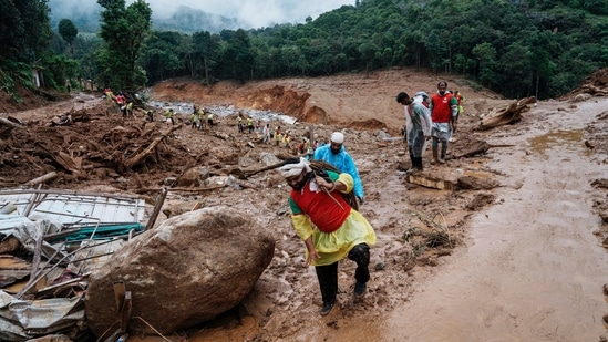 Rescuers make their way to the upper regions as they search through mud and debris for a third day after landslides set off by torrential rains in Wayanad district, Kerala state, India, Thursday, Aug. 1, 2024. (AP)