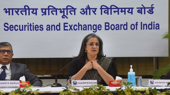 Sebi chairperson Madhabi Puri Buch with Whole Time Members (WTM) Ananta Barua (left) and Ashwani Bhatia during a press conference, at Sebi head office in Mumbai.(PTI)