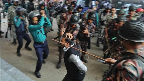 Law enforcers charge batons to disperse followers demanding release of their leader Chinmoy Krishna Das. (REUTERS)