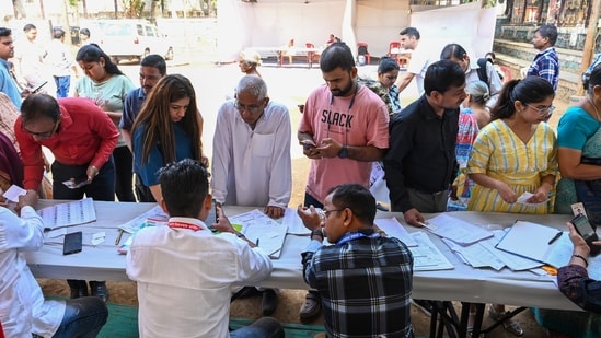 Kolhapur election results LIVE: People searching for their name in the voting list outside a Polling station during the Maharashtra State Assembly elections in Mumbai. Mumbai, India. Nov 20, 2024