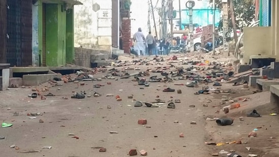 Sambhal: Footwears and brick bats lying on a road after violence erupted during the second survey of the Jama Masjid.(PTI)