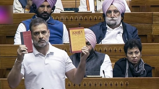 Leader of Opposition in the Lok Sabha Rahul Gandhi shows copies of the Constitution and Manusmriti in Parliament on Saturday. (ANI) Leader of Opposition in the Lok Sabha Rahul Gandhi shows copies of the Constitution and Manusmriti in Parliament on Saturday. (ANI)
