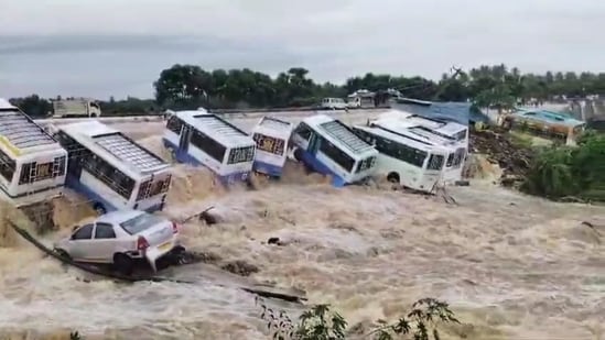 Buses swept away vehicles in the flooded Uthangarai area following heavy rainfall in the aftermath of Cyclone Fengal,(PTI)