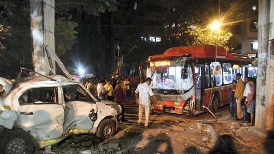 People gather near the wreckage of vehicles after a BEST undertaking's bus rammed into pedestrians as well as vehicles on a road at Kurla, in Mumbai.(PTI) People gather near the wreckage of vehicles after a BEST undertaking's bus rammed into pedestrians as well as vehicles on a road at Kurla, in Mumbai.(PTI)