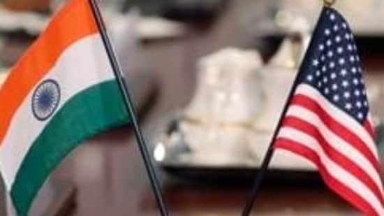 The flags of the United States and India adorn a conference table during a meeting between (AFP/File)