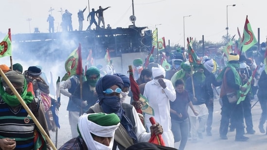 Patiala: Tear gas being used to disperse protesting farmers at Shambhu Border during their foot march towards Delhi.(PTI)