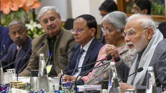 PM Narendra Modi and finance minister Nirmala Sitharaman at a meeting with economists and sector experts on Tuesday. (PTI)