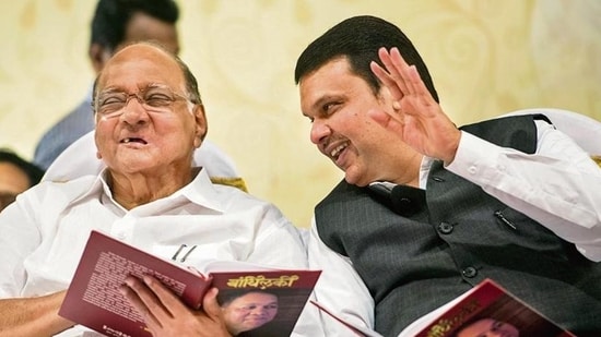 File photo of the President of NCP Mr. Sharad Pawar and Maharashtra Chief Minister Devendra Fadnavis during 61st Birthday celebration of Mr.Dilip Walse Patil and Gauravgranth Prakashan at Ravindranatya Mandir, Prabhadevi in Mumbai.(Hindustan Times)