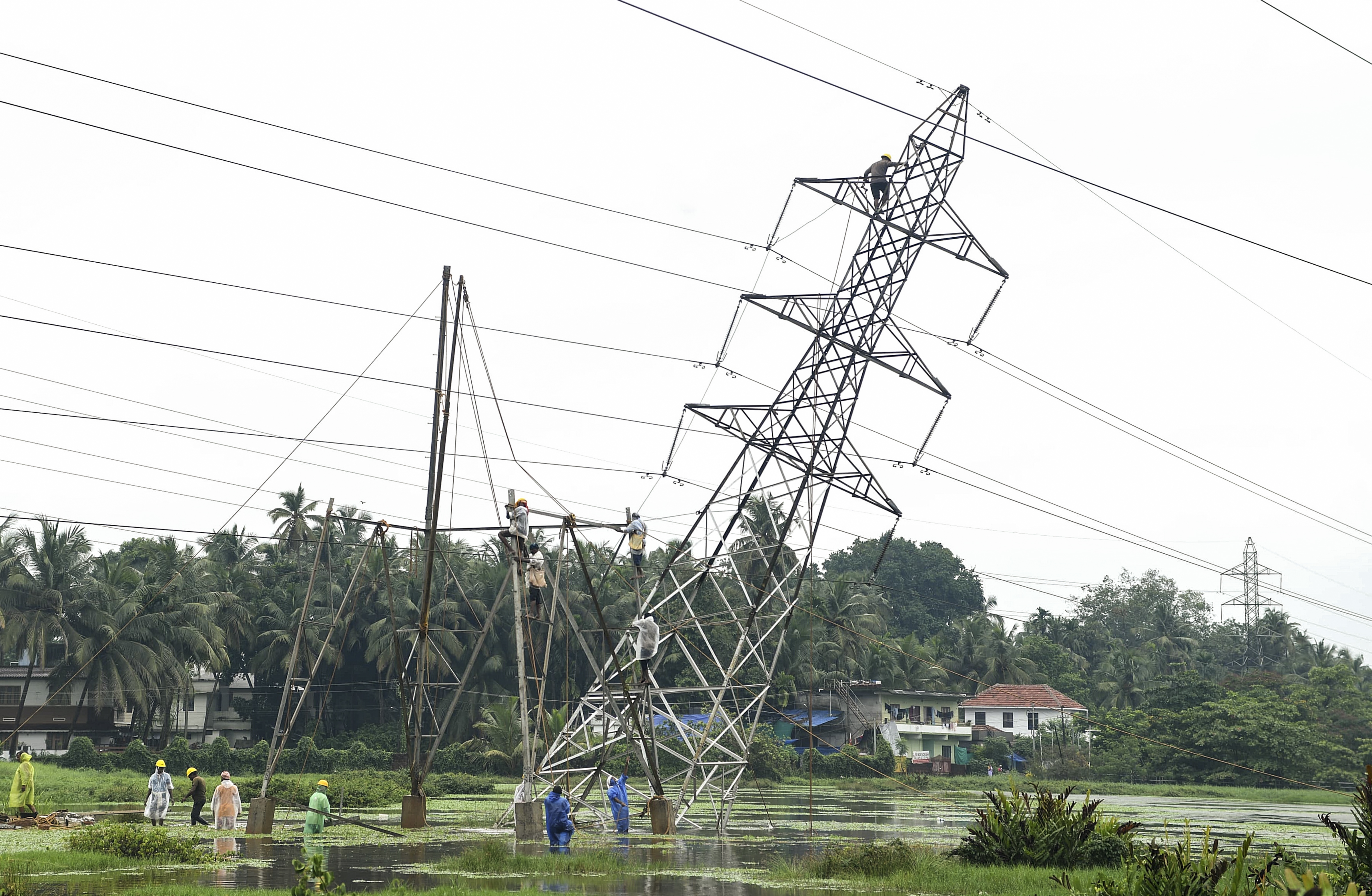Restoration work underway after a KSEB high tension tower tilted following heavy rainfall, at Nallalam, in Kozhikode, Kerala, Saturday, May 24, 2025.(PTI) Restoration work underway after a KSEB high tension tower tilted following heavy rainfall, at Nallalam, in Kozhikode, Kerala, Saturday, May 24, 2025.(PTI)
