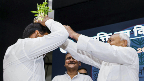 Bihar Chief Minister Nitish Kumar's act during the event garnered sharp criticism from RJD spokesperson Mrityunjay Tiwary.(PTI) Bihar Chief Minister Nitish Kumar's act during the event garnered sharp criticism from RJD spokesperson Mrityunjay Tiwary.(PTI)