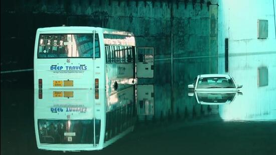 Vehicles partially submerged following rains at an underpass in New Delhi on Sunday. (PTI)