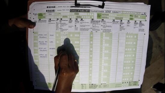 A census official collects information from a household in Guwahati in 2011. (AP)(AP) A census official collects information from a household in Guwahati in 2011. (AP)(AP)
