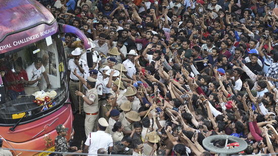 Fans cheer as the bus carrying Royal Challengers Bengaluru cricketers, winners of the Indian Premier League, arrive at the M. Chinnaswamy Stadium in Bengaluru, India, Wednesday, June 4, 2025.(AP) Fans cheer as the bus carrying Royal Challengers Bengaluru cricketers, winners of the Indian Premier League, arrive at the M. Chinnaswamy Stadium in Bengaluru, India, Wednesday, June 4, 2025.(AP)